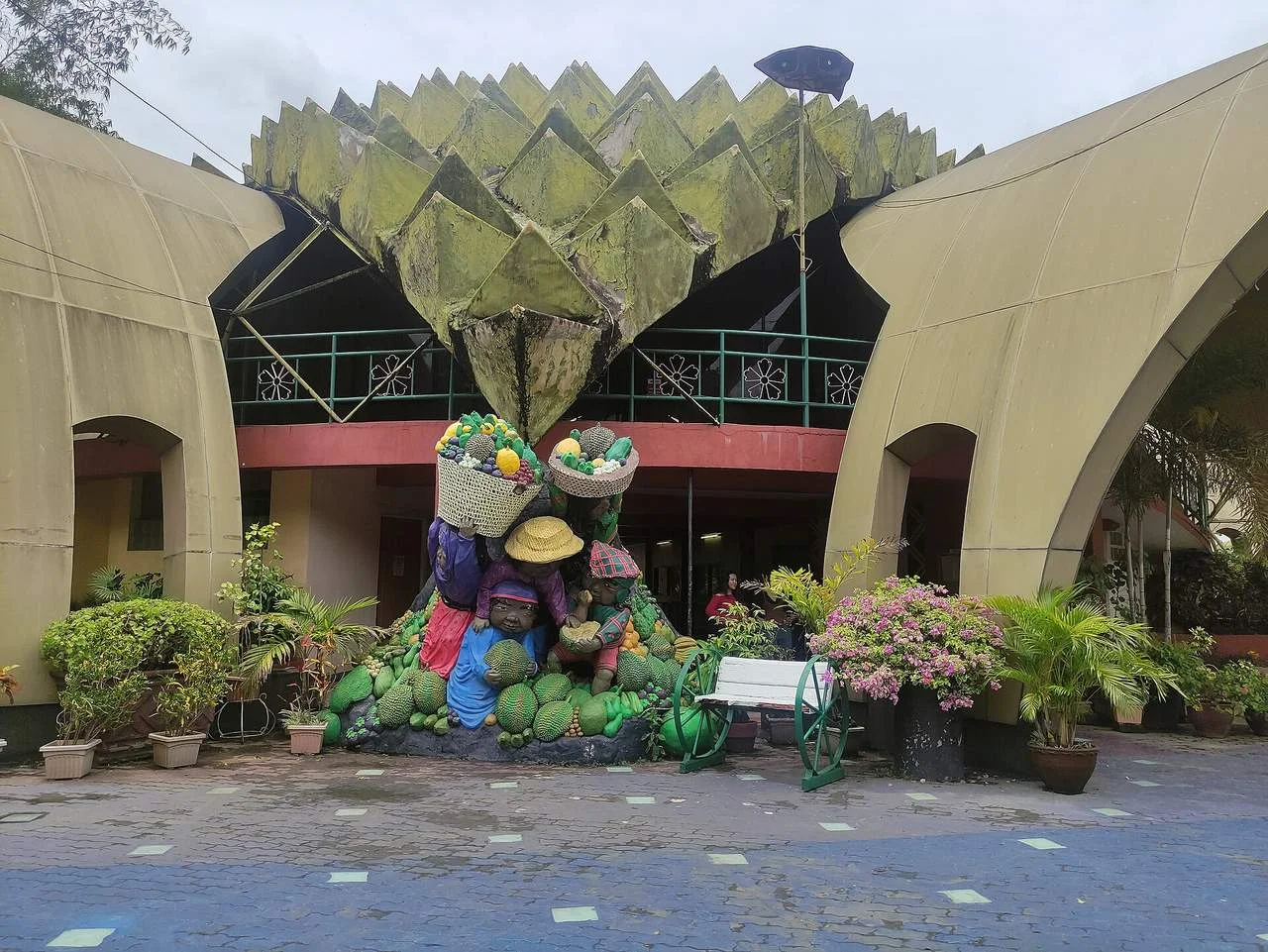 The durian-shaped dome and fruit vendor sculpture at the entrance of People's Park in Davao City