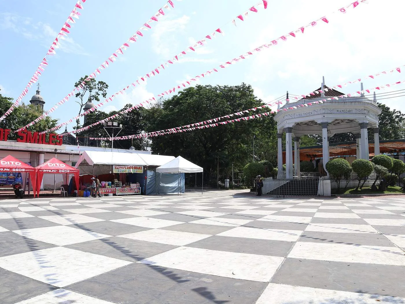 Bacolod Public Plaza with its white bandstand, checkered paving and festival bunting