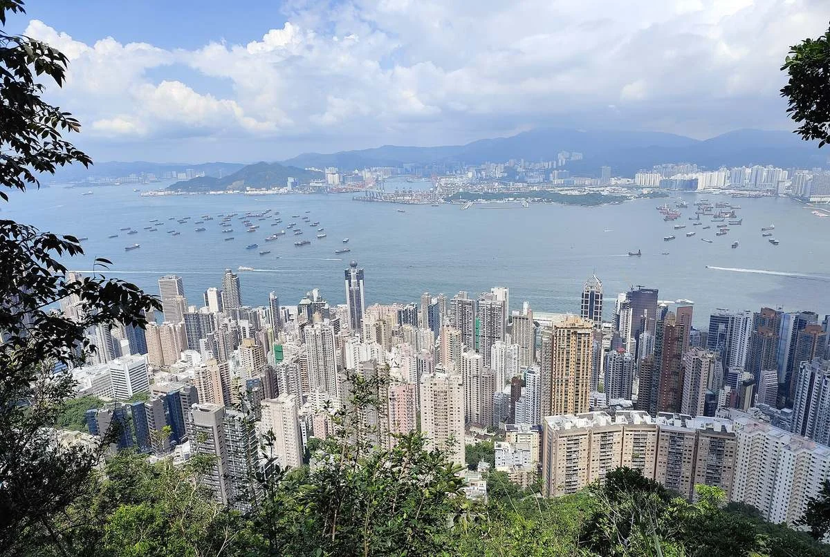 View over the Mid-Levels towers and Victoria Harbour from Lugard Road on Victoria Peak, Hong Kong