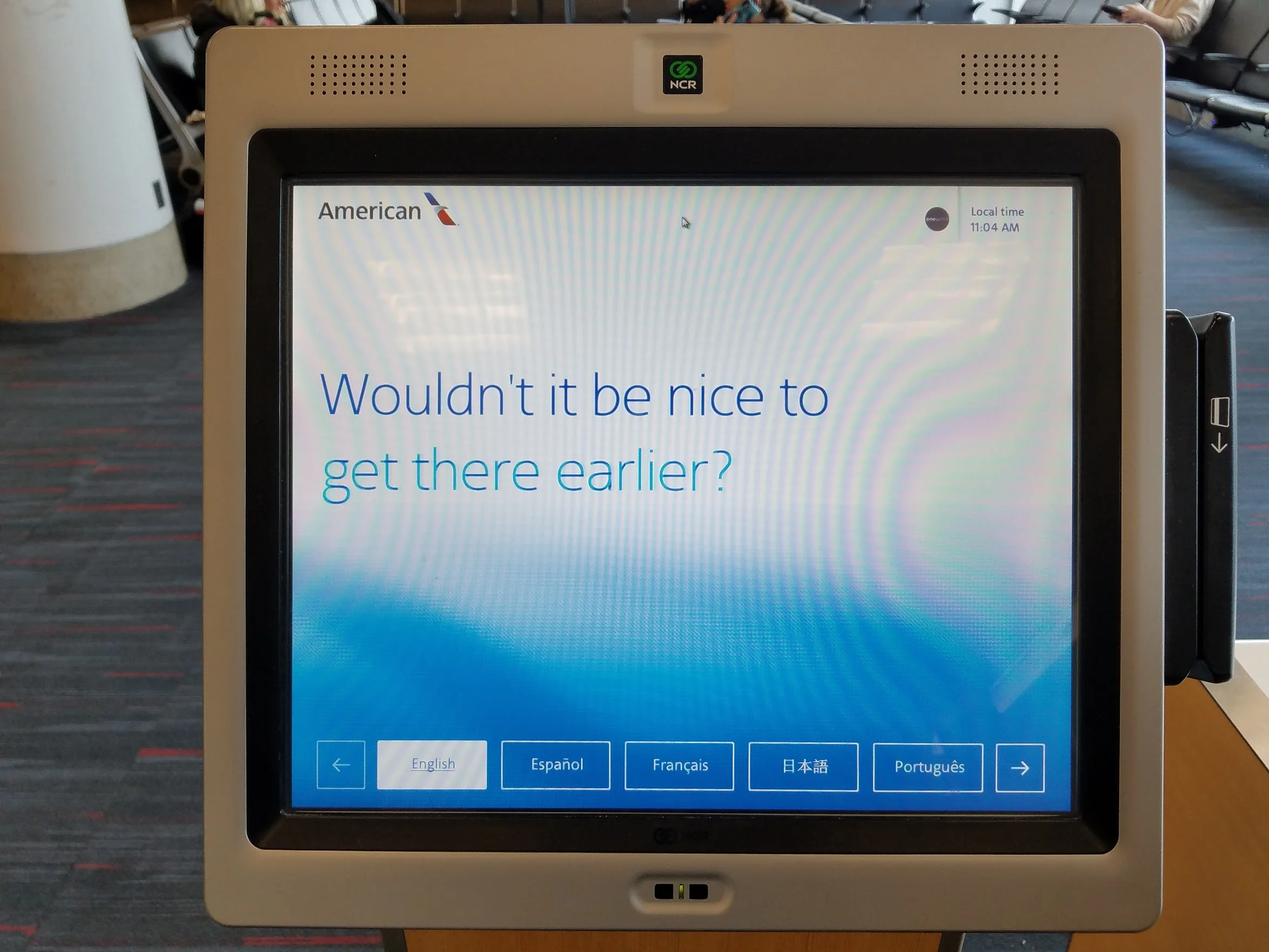 American Airlines airport kiosk displaying Wouldn't it be nice to get there earlier?